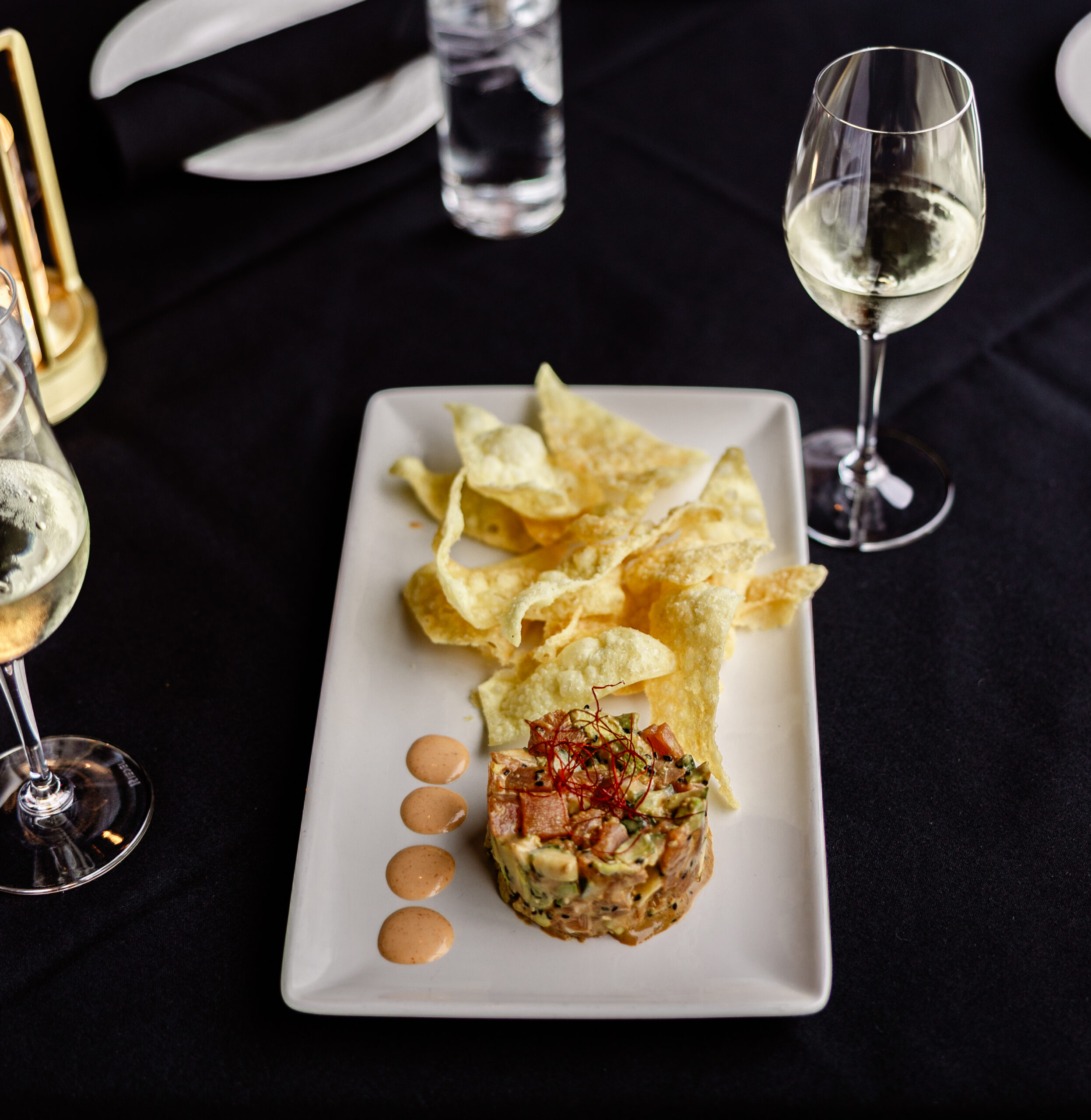 Ahi tuna with avocado, cucumber, sauces and wonton chips